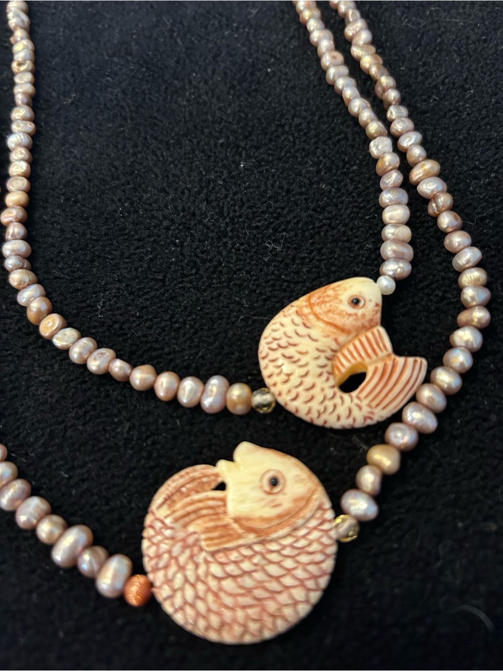 Beautiful hand carved bone fish necklace